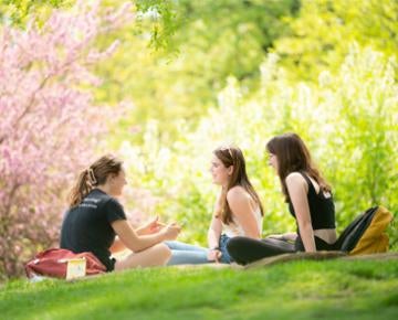 Students sit and talk on the Pittsburgh Campus.