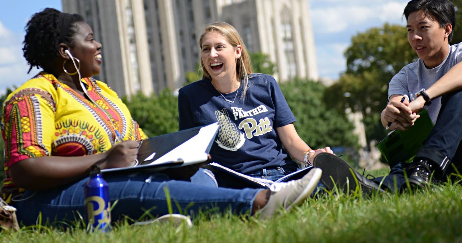 Three students talking outside