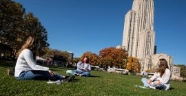 Students studying on Cathedral lawn
