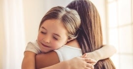 Woman and daughter hugging 